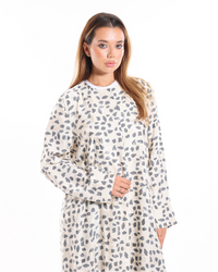 Full-length view of the Marble Abaya showcasing the flowing grey and ivory print, premium fabric, and sophisticated modest fashion design.