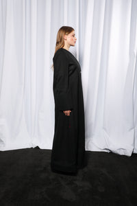 Back view of Minimalistic abaya displaying smooth finish and refined simplicity