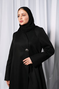 Full length front view of Minimalistic abaya showcasing streamlined cut and structured drape