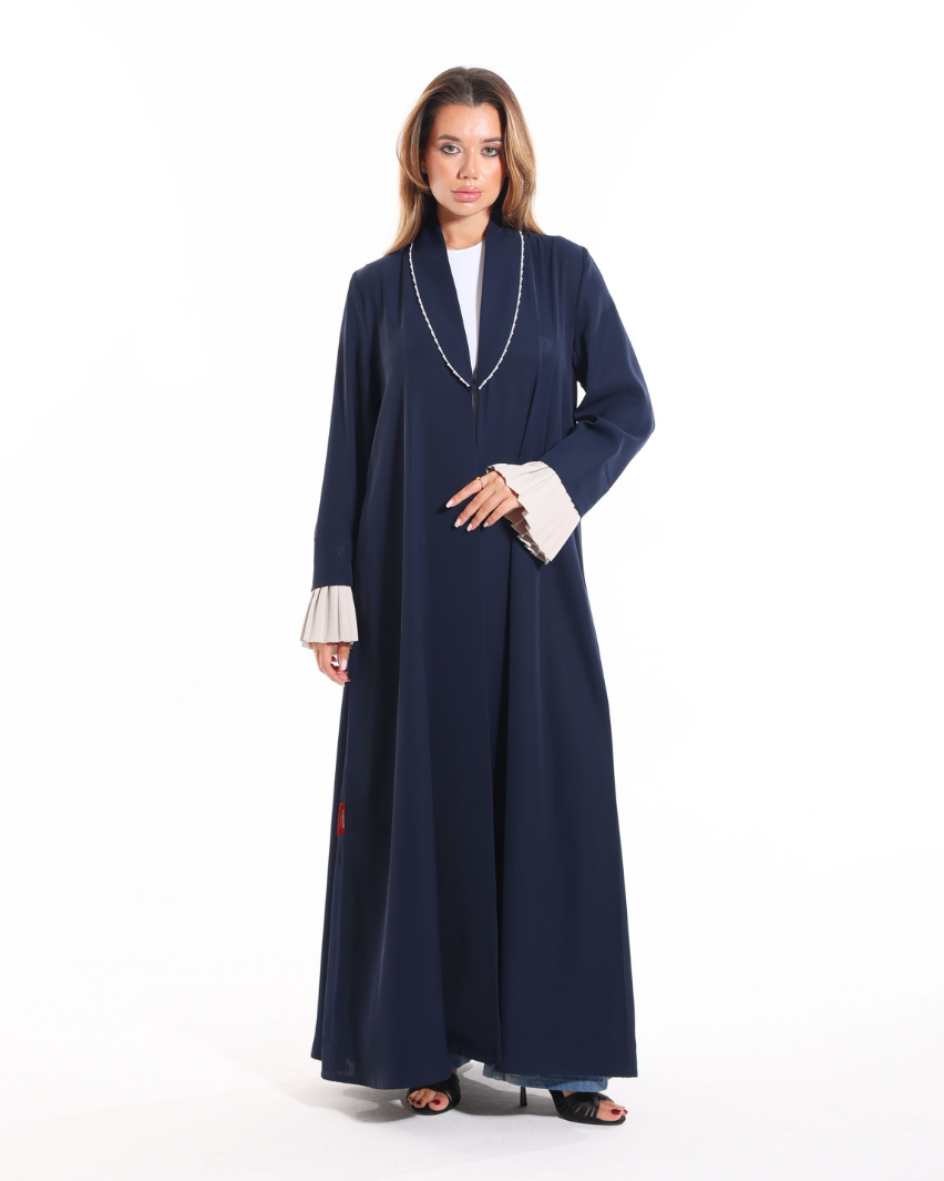 Pearl Affair abaya from Esme Abaya Summer '26 collection featuring elegant pearl detailing and luxurious modest fashion design.