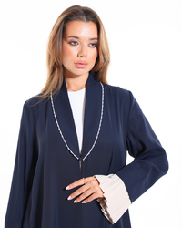 Close-up view of Pearl Affair abaya showcasing intricate pearl embellishments and premium craftsmanship by Esme Abaya.