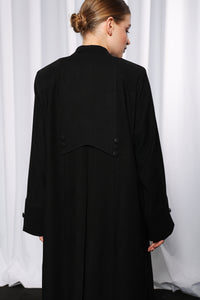 Back view of Rich Routine abaya displaying clean finish and modest design