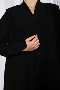 Fabric texture of Rich Routine abaya highlighting soft premium material and smooth weave