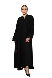 Rich Routine abaya front view featuring refined modest silhouette and elegant structure