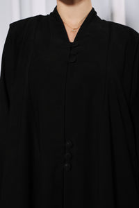 Sleeve detail of Rich Routine abaya showing precise tailoring and premium stitching