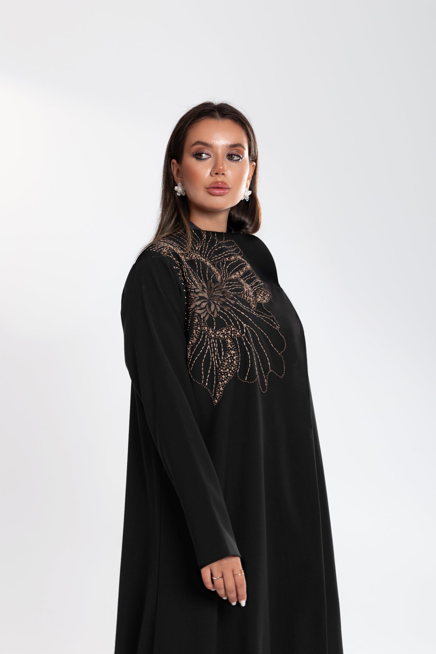 side shot of Woman wearing Esme embroidered Abaya from qatar