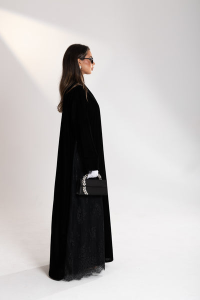 side shot showing the lace details of esme black velvet abaya 