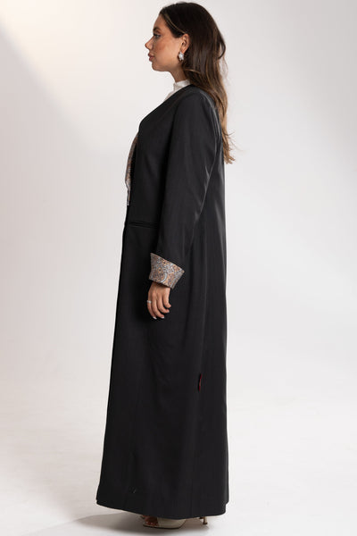 Woman wearing an esme gray blazer with patterned cuffs 