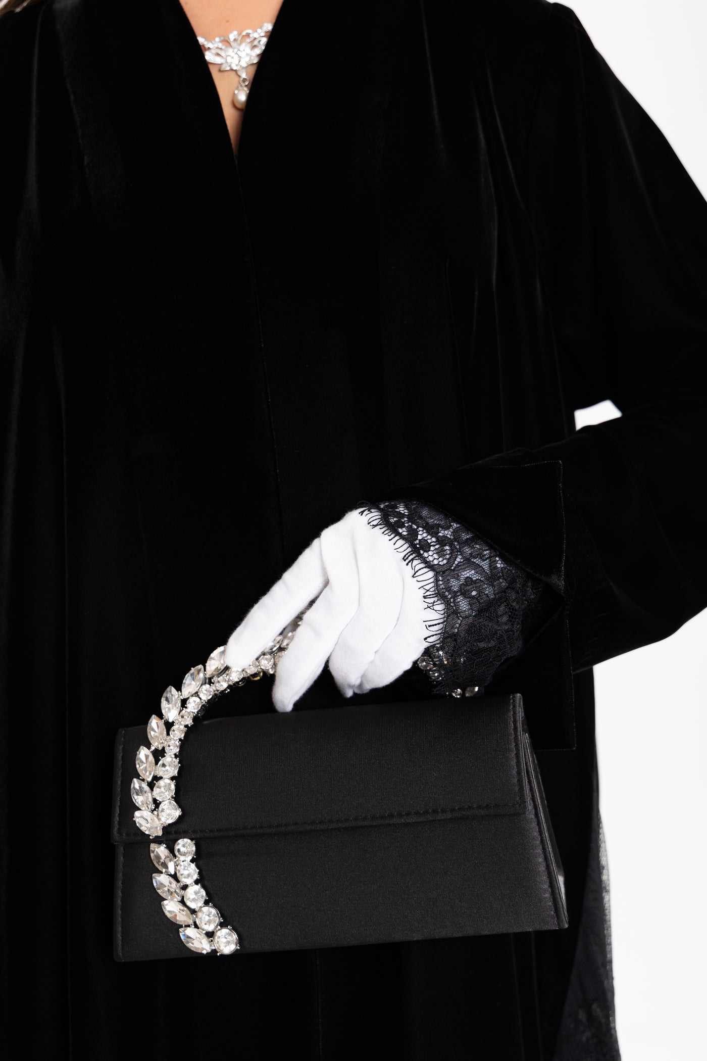 Black velvet abaya details by Esme Abaya, luxury winter modest wear from Qatar