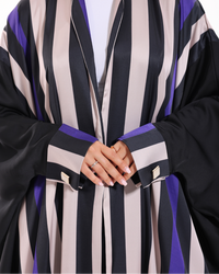Close-up view of Stripe Studio Bisht showcasing its refined stripe pattern and premium craftsmanship by Esme Abaya.