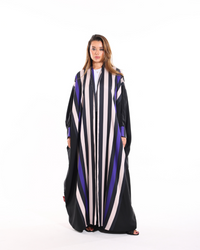 Stripe Studio Bisht from Esme Abaya Summer '26 collection featuring elegant striped detailing and a luxurious modest fashion design.