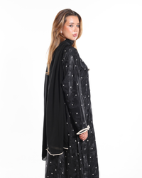 Close-up of the three decorative bows and concealed button closure on The Bow Theory Abaya by Esmeabaya.