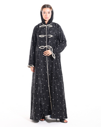 The Bow Theory Abaya front view featuring elegant bow detailing, rich patterned Turkish fabric, and a luxury modest silhouette by Esmeabaya.