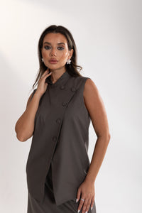 close up of Woman wearing Esme Abaya tailored vest .