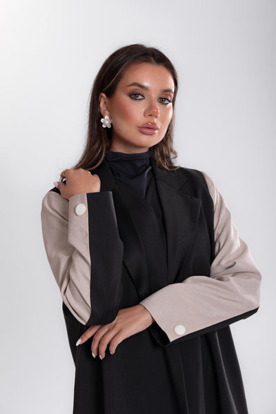 zoomed shot of Woman wearing Esme black and white blazer Abaya 